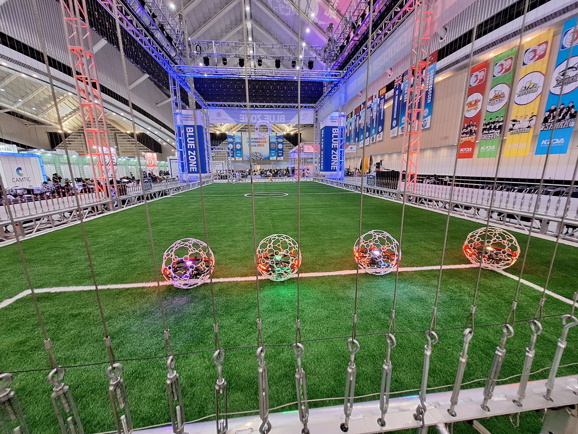Competition-ready drone-sports field with ball drones prepared for play
