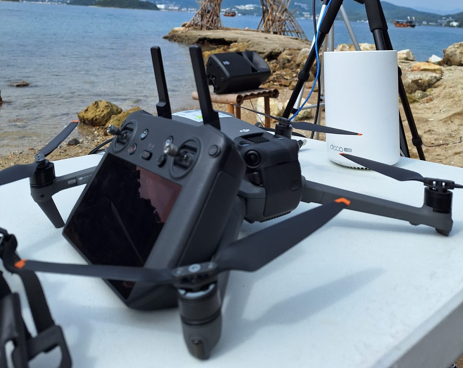 Drone cinematography equipment prepared for a waterfront filming setup